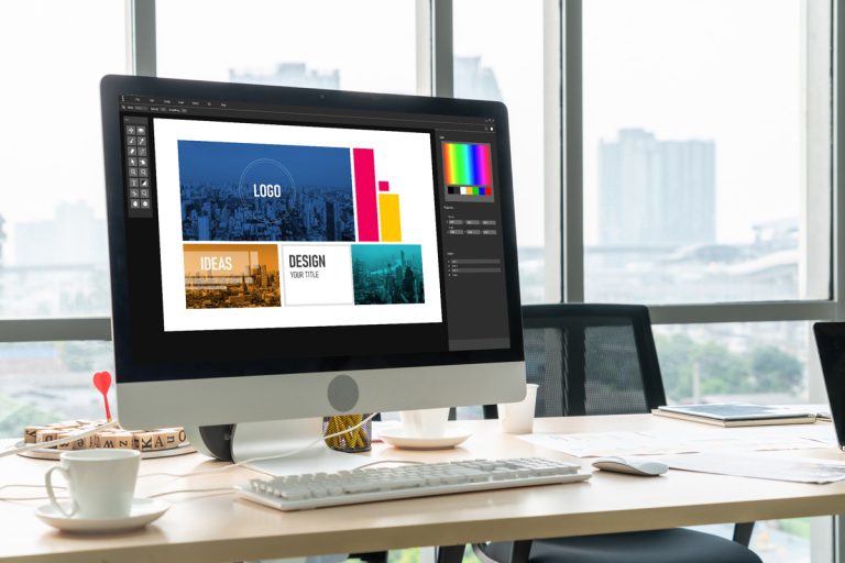 Image of a computer monitor with a picture on a desk.