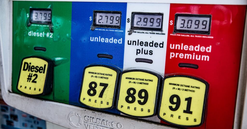 Close-up of a vintage gas pump station showing fuel prices and octane ratings in Los Angeles.