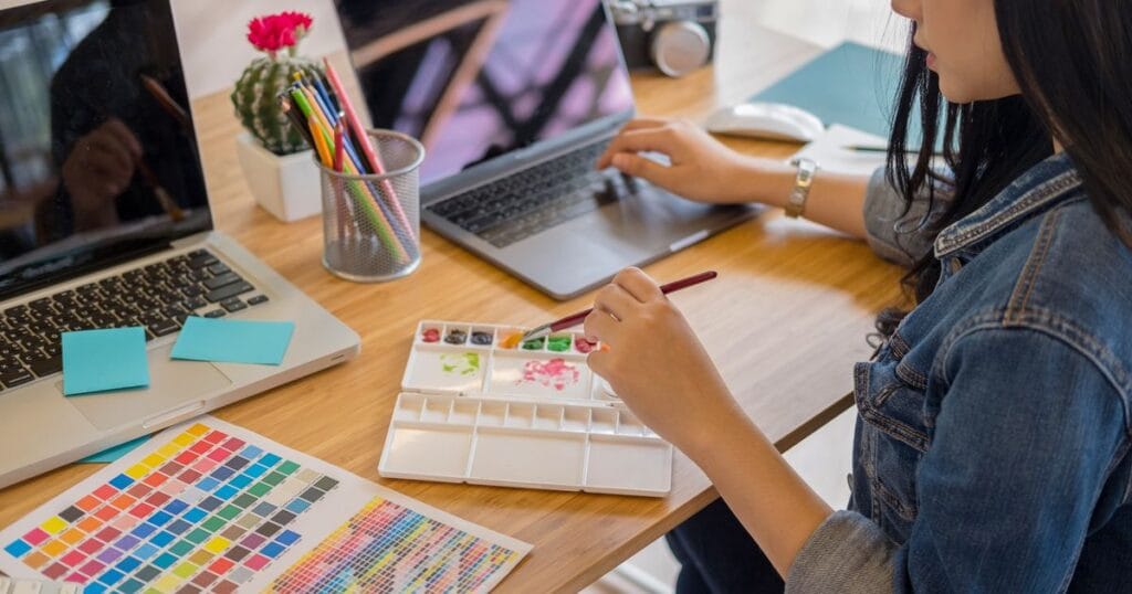 web page designer reviewing design mockups for client project